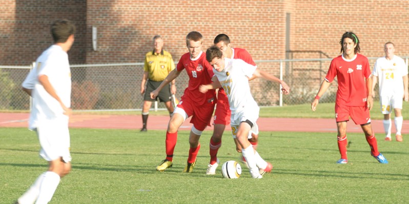 Freshman Mike Haight battles to maintain possession against a pair of Saint Mary's defenders.