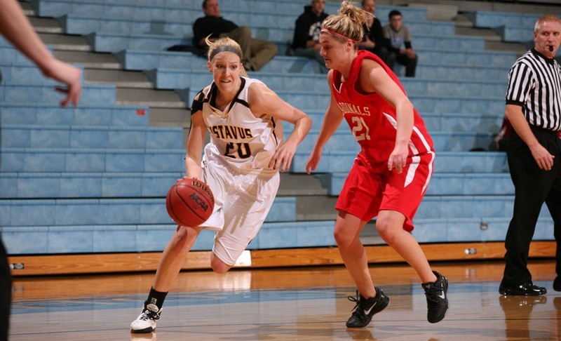 Britta Rinke drives baseline on Saint Mary's Jessica Thone Wednesday night at Gus Young Court. Photo courtesy of Tyler Grey - Gustavus Sports Information.
