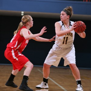 Stephanie Comer looks to the post for an entry pass. Comer finished with a season-high 19 points against the Cardinals. 