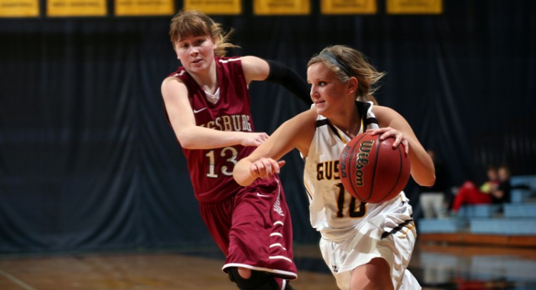 Rachelle Blaschko drives baseline on Augsburg's Abbey Luger in Wednesday night's win at Gus Young Court.