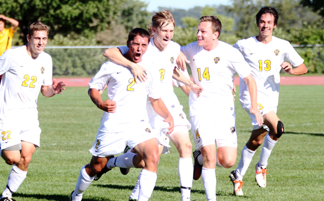 Senior captain Sean Sendelbach mobbed by teammates following what would turn out to be the game-winning goal in Gustavus's 1-0 win over Concordia on Saturday afternoon.