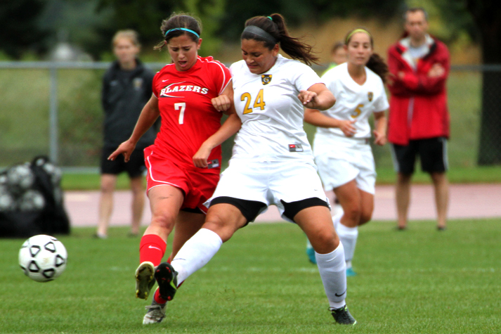 Senior Emily Papagapitos battles for possession with Saint Benedict's Colleen Bouchard. (Photo courtesy of Jessica Williams '16)