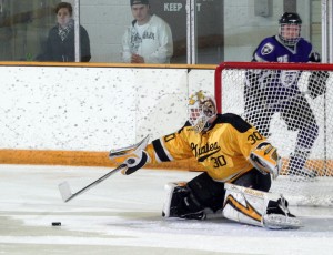 Josh Swartout makes one of his 20 saves in the game.