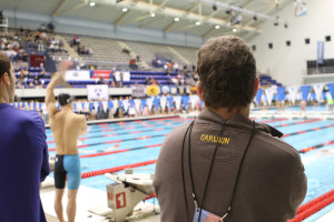 Coach Carlson looks on during this morning's prelim session. 