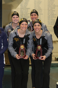 The 200-free relay team on the podium after taking fourth place in the championship finals. 