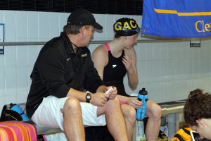 Coach Carlson talks with Jenny Strom following Friday morning's session. 