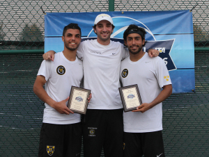 Motasem Al-Houni (left), head coach Tommy Valentini (center) and Andres Saenz pose after winning the USTA/ITA Midwest Regional doubles title on Sunday.
