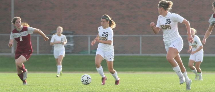 Emily Skogseth (25) dribbles past an Augsburg defender. Skogseth scored the first goal of the game.