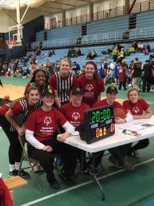 Student-athlete volunteers pose for a picture at the basketball competition.