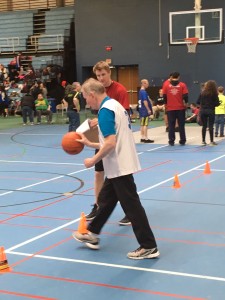 Brian Jacobs helps coach a Special Olympics athlete.