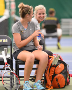 Cal and Heidi share a laugh in a recent Gustie tennis match.