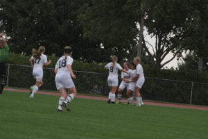 Grace Brustad and teammates celebrate her first goal in Black and Gold. (Gunnar Ledin '20)
